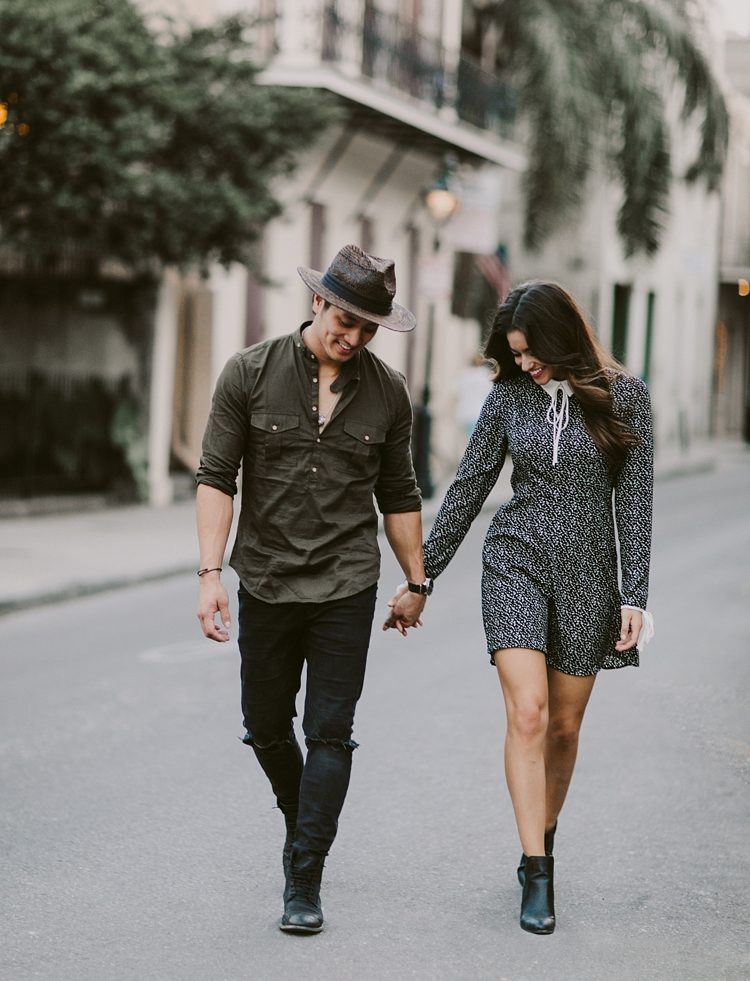 Stylish couple walking through the streets of New Orleans French Quarter